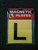 PLATE L MAGNETIC BLACK L YELLOW BACKGROUND